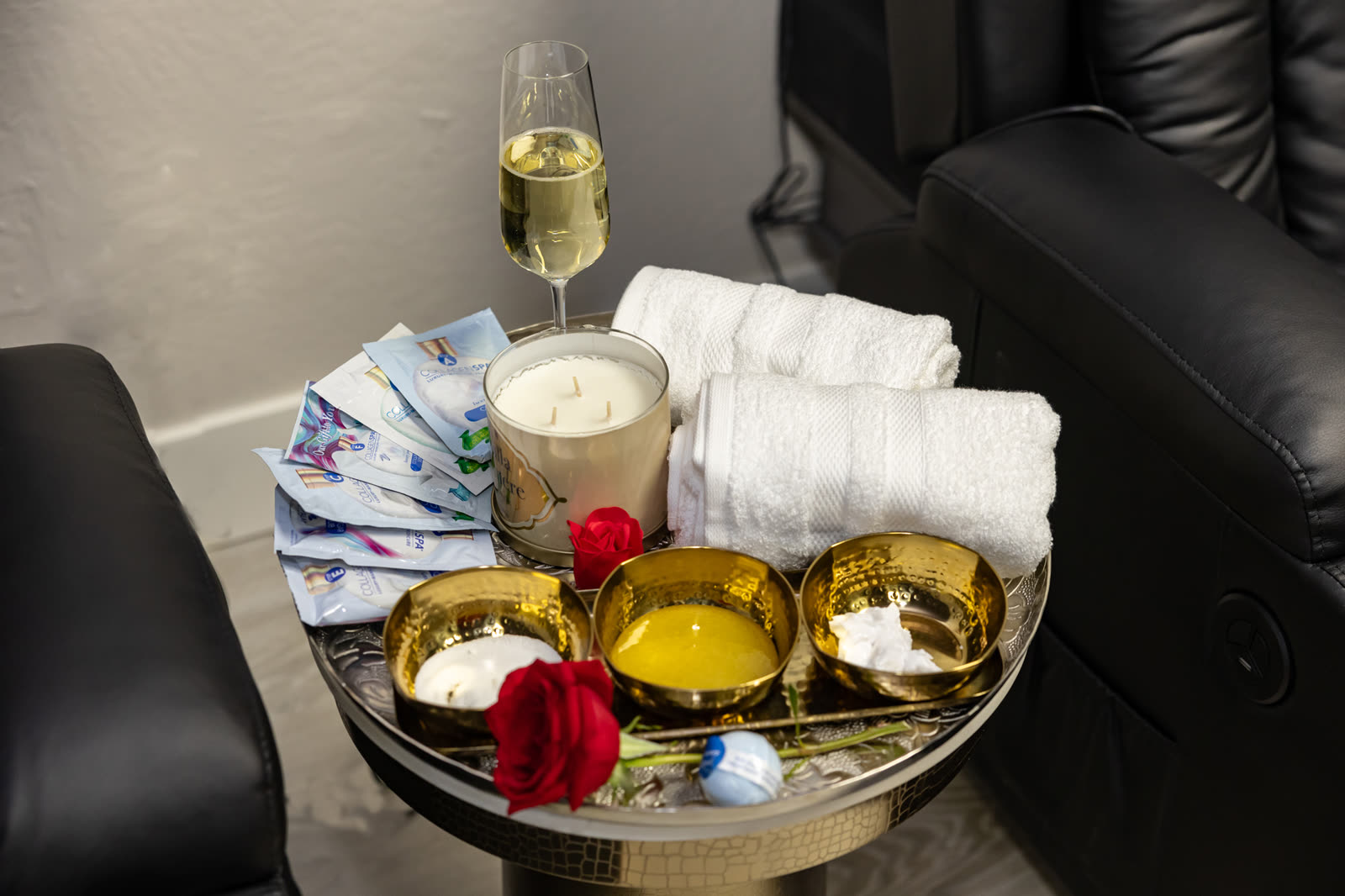Hannah Beauty & Spa Placerville &mdash; service tray with champagne, candle, gold treatment bowls and white towels